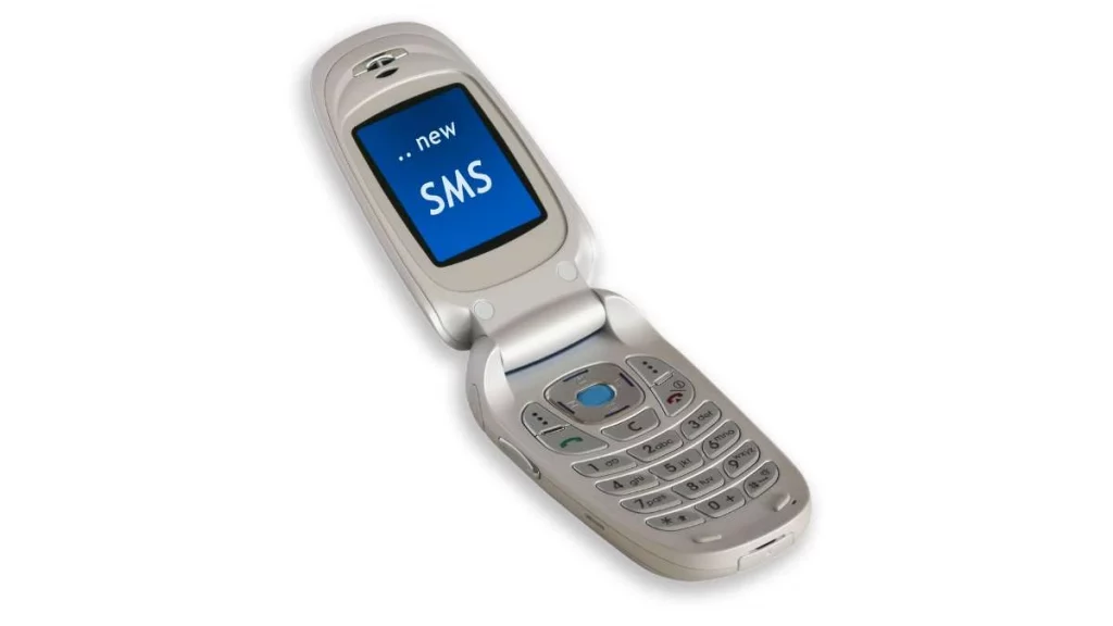 5 - gambar handphone berjenis flip dengan notifikasi SMS