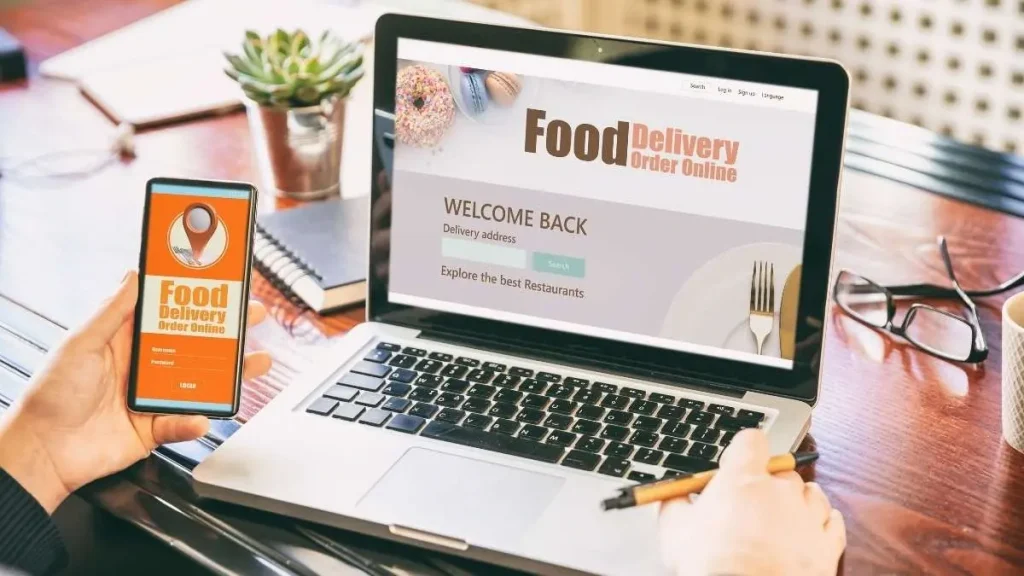 5 - Gambar laptop dan handphone yang menampilkan food delivery